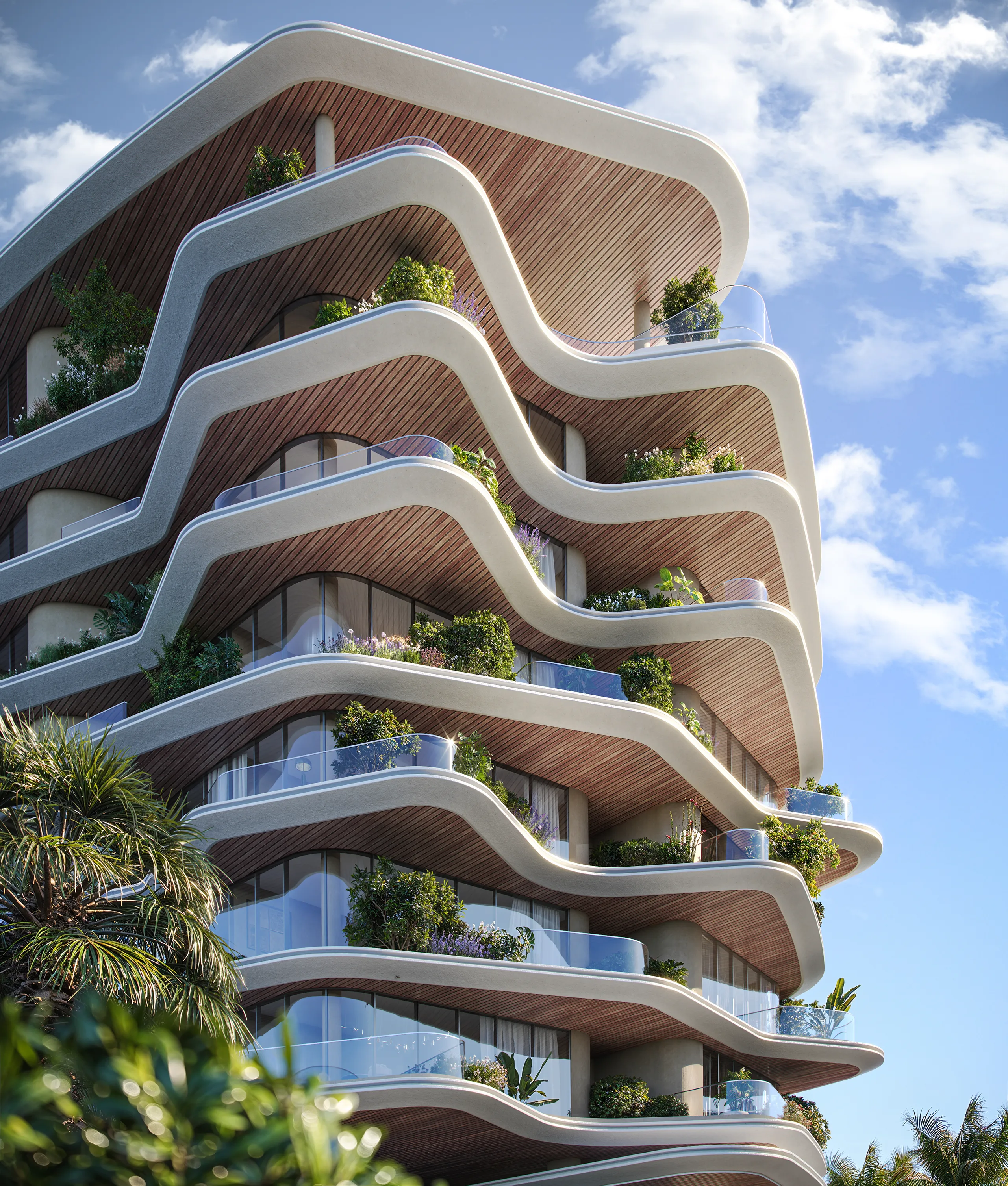 Street-level view of Lia’s main façade with curved balconies and soft evening light